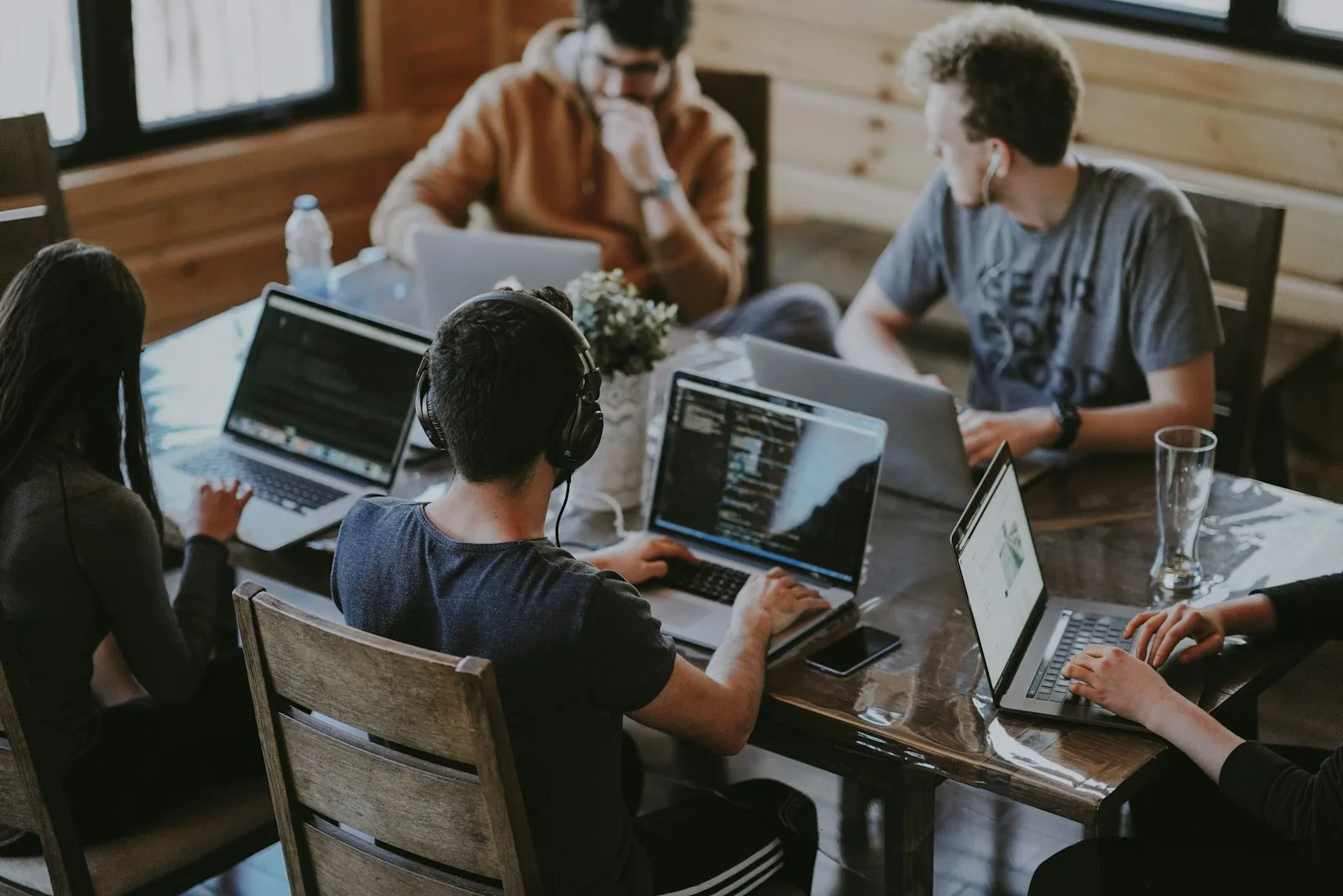 The Innector team collaborating around laptops