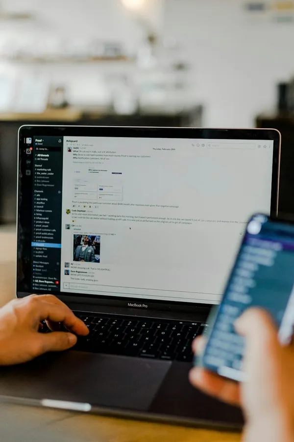 Managing social media on a laptop and phone