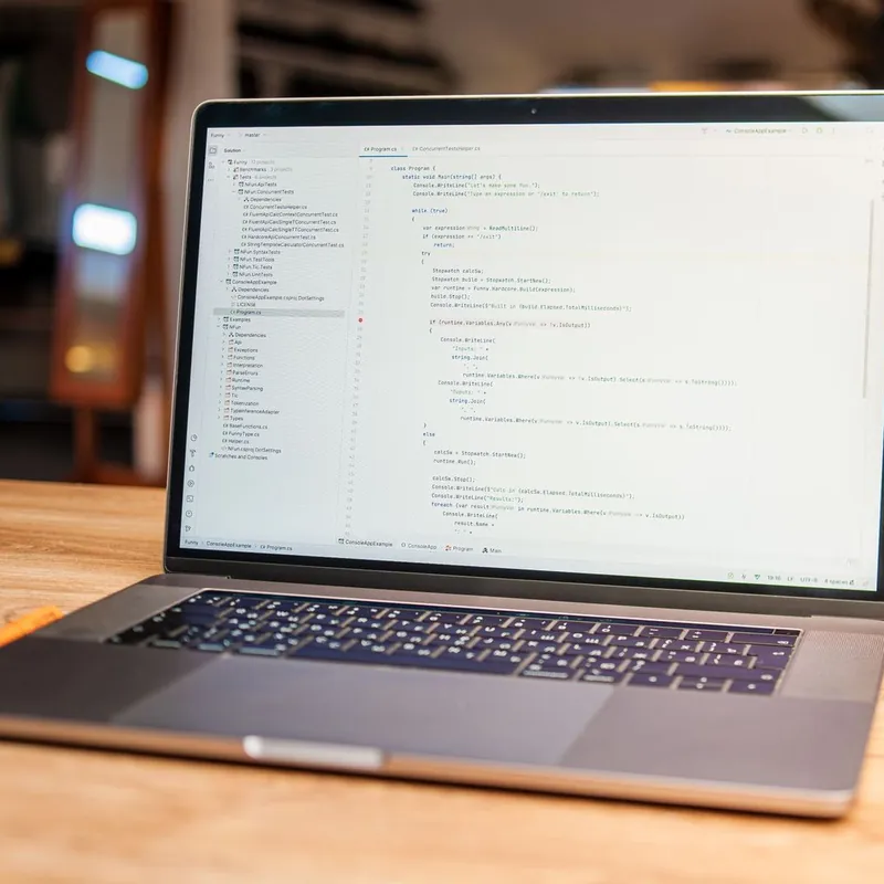 A laptop showing website code