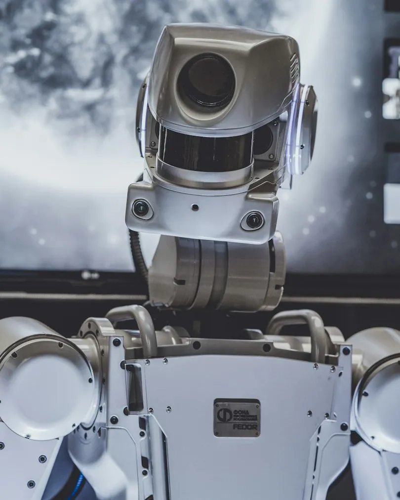 A robot with a camera for a head, representing custom AI development